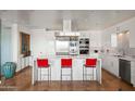 Gourmet kitchen features a waterfall island with seating and stainless steel appliances and finishes at 17 W Vernon Ave # 508, Phoenix, AZ 85003