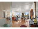 Expansive living room showcases floor-to-ceiling windows offering views and a decorative glass privacy wall at 17 W Vernon Ave # 508, Phoenix, AZ 85003