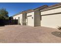 Spacious driveway leading to a three car garage at 18029 W San Miguel Ave, Litchfield Park, AZ 85340