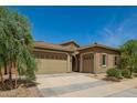 Inviting single-story home with a two car garage, desert landscaping and a cozy entrance at 24478 N 166Th Ave, Surprise, AZ 85387