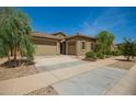 Inviting single-story home with a two car garage, desert landscaping and a cozy entrance at 24478 N 166Th Ave, Surprise, AZ 85387