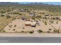 An aerial view shows the home's large lot and privacy in the desert landscape at 270 S Ralston Rd, Maricopa, AZ 85139