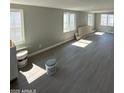 Spacious living room showcasing abundant natural light and modern flooring at 300 S Val Vista Dr # 17, Mesa, AZ 85204