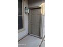 Close up of the front door with outdoor lantern lighting and painted trim at 31138 N 130Th Ln, Peoria, AZ 85383