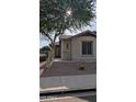 Charming home with desert landscaping, a shade tree, and sidewalk appeal at 31138 N 130Th Ln, Peoria, AZ 85383