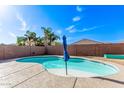 A refreshing backyard pool featuring easy access and privacy fencing, perfect for outdoor relaxation and entertaining at 40010 W Ganly Way, Maricopa, AZ 85138