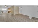 Spacious living room boasting hard surface floors that lead to an updated kitchen at 461 W Holmes Ave # 180, Mesa, AZ 85210