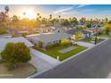 Bright aerial shot of a well-manicured property with lush lawn, mature trees, and neighborhood views at 4610 N 14Th Ave, Phoenix, AZ 85013
