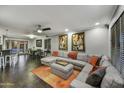 Spacious living room with a comfortable sectional sofa, ceiling fan, and access to outdoor patio at 4610 N 14Th Ave, Phoenix, AZ 85013
