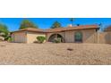 Charming single-story home with desert landscaping, complemented by a two-car garage at 4957 W Onyx Ave, Glendale, AZ 85302