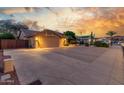 Attractive home featuring mature landscaping and a spacious driveway at 6918 W Villa Hermosa W --, Glendale, AZ 85310
