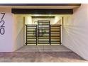 Striking front entryway with modern horizontal slat gate providing curb appeal and privacy at 720 E Chilton Dr, Tempe, AZ 85283