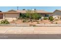 Single-story home featuring a landscaped front yard with small plants and minimal design elements at 8116 N 55Th Dr, Glendale, AZ 85302