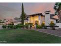 Gorgeous home with a manicured lawn and lush shrubbery leading to an inviting front entryway at 9921 E Doubletree Ranch Rd, Scottsdale, AZ 85258