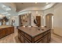 Open concept kitchen with a center island and granite countertops at 14332 E Bobwhite Way, Scottsdale, AZ 85262