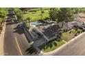 Aerial view of home with private pool, near golf course and lush landscaping at 1509 W Kiowa Ave, Mesa, AZ 85202
