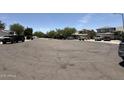 View of a quiet street with well-maintained homes and parked cars at 16784 W Polk St, Goodyear, AZ 85338