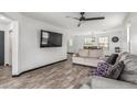 Open-concept living space with wood-look floors and a seamless flow to the dining area at 1700 S Martingale Rd, Gilbert, AZ 85295