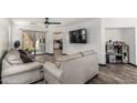 Inviting living room with wood-look floors and a sliding glass door leading to the outdoor space at 1700 S Martingale Rd, Gilbert, AZ 85295