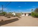 Charming single-story home with circular driveway and desert landscaping at 1845 N 64Th St, Scottsdale, AZ 85257