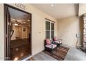 Welcoming front patio with comfortable seating and stylish decor, creating a cozy outdoor space at 2470 E Roma Ave, Phoenix, AZ 85016