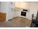 Efficient kitchen features ample white cabinetry and modern appliances at 303 S Recker Rd # 78, Mesa, AZ 85206
