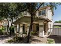 Charming two-story home with covered porch and landscaped front yard at 3037 E Hobart St, Gilbert, AZ 85296