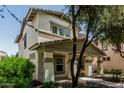 Charming two-story home with covered porch and landscaped front yard at 3037 E Hobart St, Gilbert, AZ 85296