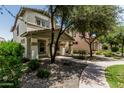 Charming two-story home with covered porch and landscaped front yard at 3037 E Hobart St, Gilbert, AZ 85296