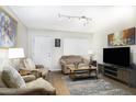 Cozy living room featuring plush seating, ample lighting, and stylish decor at 310 W Earll Dr # 102, Phoenix, AZ 85013