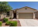 Charming single-story home with a well-kept lawn and a two-car garage, providing comfort and curb appeal at 40066 W Jenna Ln, Maricopa, AZ 85138