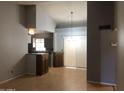 View of a living room featuring hardwood floors and neutral-colored walls at 4042 E Carson Rd, Phoenix, AZ 85042