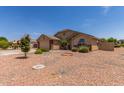 Exterior of a single-story home with desert landscaping and a well-maintained lawn at 4307 E Shetland Dr, San Tan Valley, AZ 85140