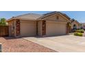 Spacious two-car garage with brick accents and a concrete driveway at 4307 E Shetland Dr, San Tan Valley, AZ 85140
