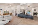 Spacious living room featuring high ceilings, a fireplace, and a modern aesthetic at 6325 E Helm Dr, Scottsdale, AZ 85254