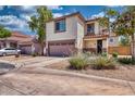 Street view of a well-maintained two-story home featuring desert landscaping and attached two-car garage at 1090 S Bogle Ct, Chandler, AZ 85286