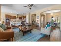 Spacious living room with modern decor and seamless flow into the dining area at 10914 E Tarragon Ave, Mesa, AZ 85212