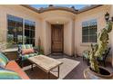 Charming front patio with comfortable seating area at 10914 E Tarragon Ave, Mesa, AZ 85212