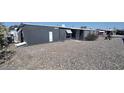The mobile home showcases an extensive gravel yard at 11000 N 91St Ave # 84, Peoria, AZ 85345