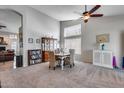 Open dining area featuring high ceilings, a ceiling fan, and large windows at 16250 S 13Th St, Phoenix, AZ 85048
