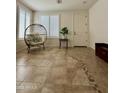 A bright entryway features decorative floor tiles, light walls, and neutral-colored furniture at 16559 W Lincoln St, Goodyear, AZ 85338
