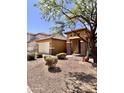 Inviting home exterior with manicured front yard and attached two-car garage at 16559 W Lincoln St, Goodyear, AZ 85338