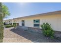 Well-maintained exterior showcasing desert landscaping and a charming single-story facade at 17441 N Del Webb Blvd, Sun City, AZ 85373