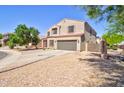 Beautiful two-story home with desert landscaping, two car garage, and well kept lawn at 2008 N Pablo Ct, Casa Grande, AZ 85122