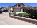 Charming two-story home features a brick facade, a two-car garage, and well-maintained landscaping at 23833 N 36Th Dr, Glendale, AZ 85310