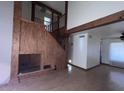 Bright living room features a fireplace, wood beams, hardwood floors, and abundant natural light at 23833 N 36Th Dr, Glendale, AZ 85310