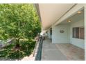 Scenic view from a balcony showcasing the lush landscaping and building architecture at 330 W Maryland Ave # 207, Phoenix, AZ 85013