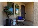Cozy front patio with comfortable seating, perfect for relaxing and enjoying the neighborhood views at 4548 S Renaissance Dr # 103, Gilbert, AZ 85297