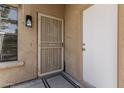 Inviting front entrance with security door and textured exterior at 515 S Saguaro Way, Mesa, AZ 85208