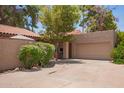 Inviting home exterior with tile roof, driveway, and mature trees at 6422 N 77Th Way, Scottsdale, AZ 85250